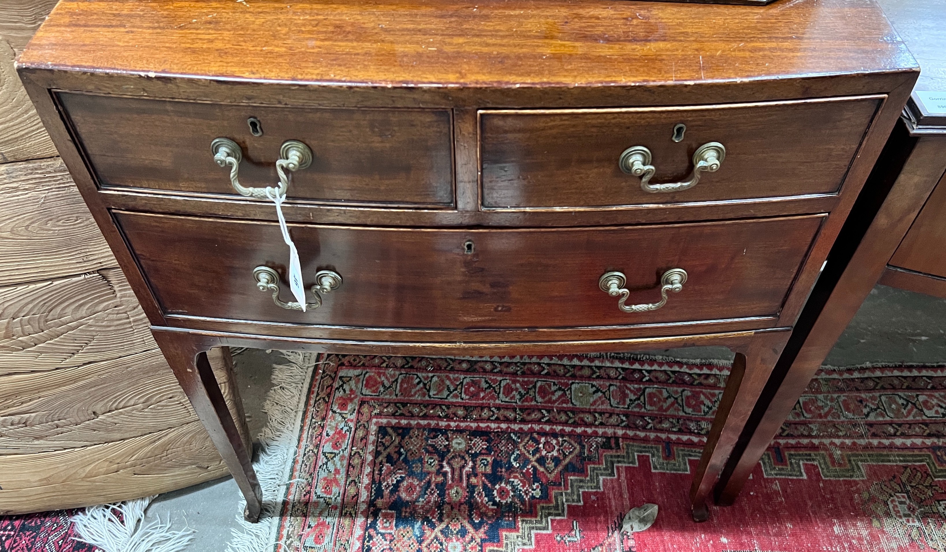 A small 1920's mahogany bowfront three drawer chest, width 71cm, depth 49cm, height 78cm *Please note the sale commences at 9am.